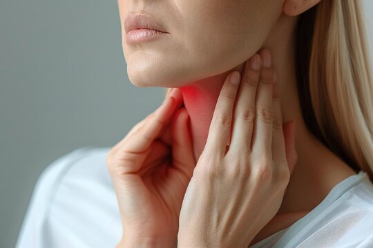 Intimate Portrait: Woman Hold Sore Throat, Expressing Pain from Thyroid and Salivary Gland Issues