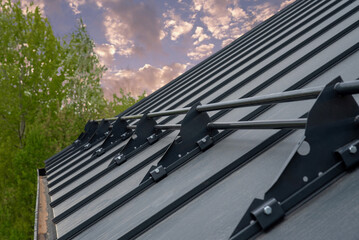 Tubular snow protection for Standing Seam Metal Roof