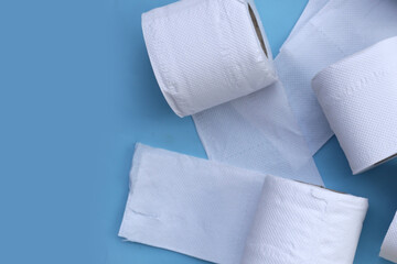 Toilet paper on blue background.