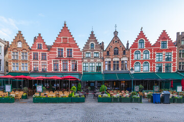 Fototapeta premium Markt, Market square, the central square abounds in gabled houses with colorful facades in Bruges, Belgium