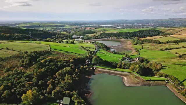 Cinematic, aerial clip of Ogden Reservoir, Oldham, on the edge of the Pennines.