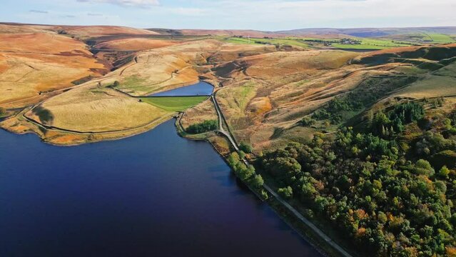 Cinematic, aerial clip of Ogden Reservoir, Oldham, on the edge of the Pennines.
