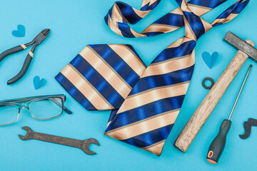 Happy Fathers Day concept. Set of manual tools, tie, spare parts, traditional symbols