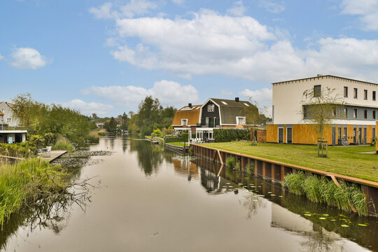 A body of water with houses on the opposite side