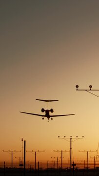 Vertical Screen: A vertical video shows an airplane landing at sunset with runway lights, appealing to aviation photography enthusiasts. The scene offers a mesmerizing view of the plane touching down