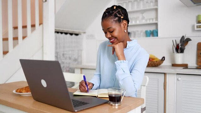 African American woman planning her online business