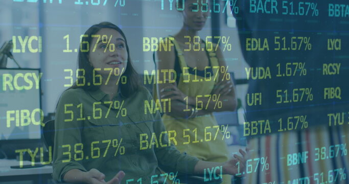 Image of stock market data processing over two diverse female colleagues discussing at office - Powered by Adobe