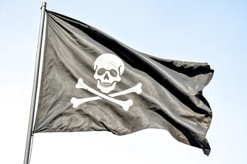 Fototapeta premium Jolly Roger Flag Waving in the Wind