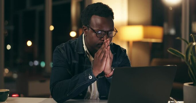 Laptop, night and overtime with business black man in office for problem solving or review. Computer, deadline and frustration with confused design employee in doubt at creative workplace in evening