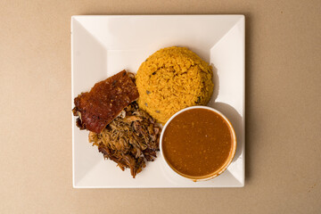 Roasted pork with yellow rice and beans