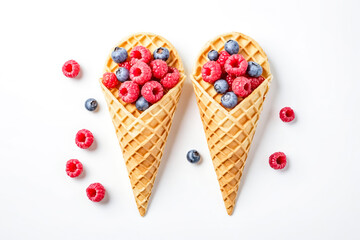 Raspberries and blueberries in waffle cones
