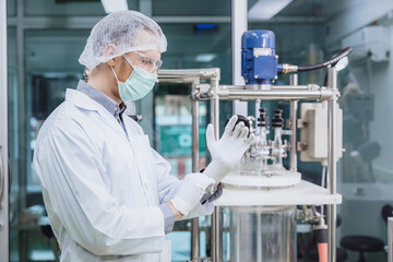 Scientist staff wearing Latex Medical Glove in Science Lab. Medical factory staff in clean room....