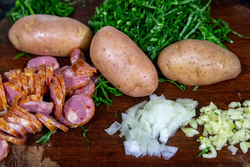 Traditional Portuguese green broth with potatoes, cabbage and chorizo ​​sausage ingredients
