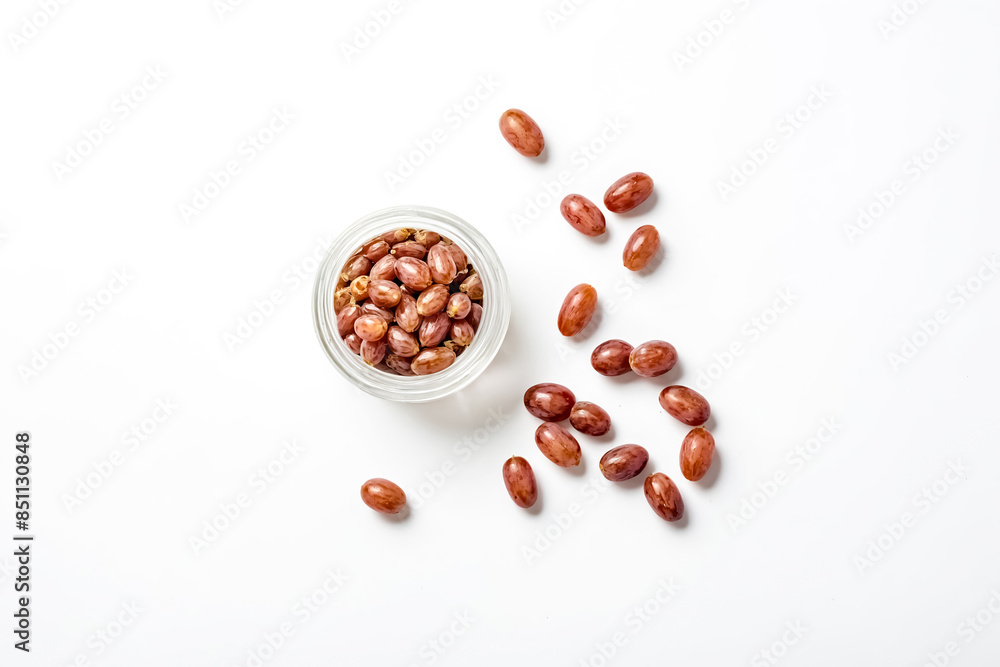 Sticker Red grapes in a glass jar on white background