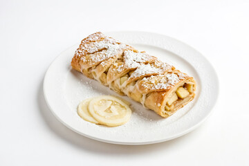 Apple Strudel with Lemon on White Plate