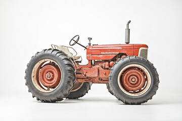 Obraz premium Vintage Red Tractor Isolated on White Background