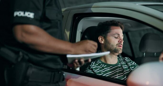 Traffic, stop and man in car with police, lights and frustrated for drunk driving, speed or siren at night. Travel, transport and driver in vehicle with highway patrol, ticket or compliance in street