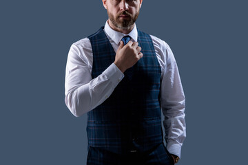Gentleman menswear. Bespoke suit. Formal menswear concept. Man businessman in formalwear, cropped view. Business man in elegant tailored vest. Formal suit vest with tie isolated grey. Formal Occasion