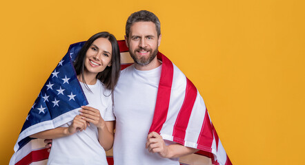 Celebrating the American spirit couple draped in the flag, advertisement. american family couple...