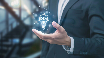 Fototapeta premium Illuminated Light Bulb with 'Idea' Inside - Conceptual Creativity and Innovation