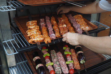 A tray of kebabs with meat and veggies a delicious dish on the table