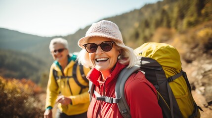 Senior women hiking in the mountains, smiling and enjoying a sunny day adventure, backpacks and trekking gear, detailed realism