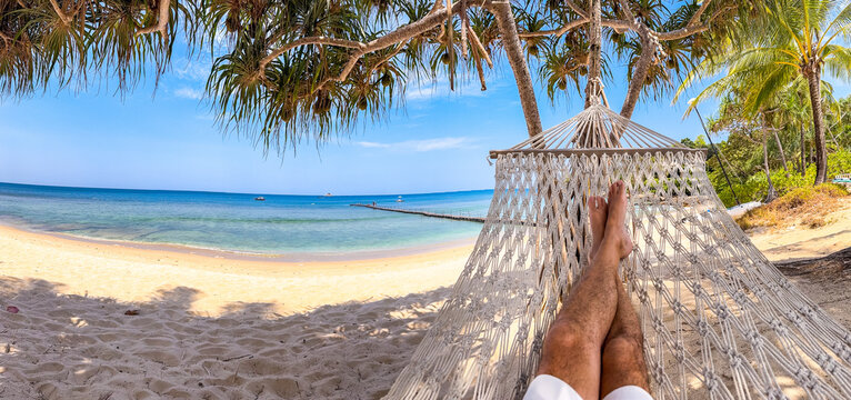 Relaxing in a hammock on the beach in Bang Tao, Phuket, Thailand
