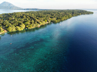 Indonesia Bunaken - Drone view Bunaken Island with coral reef and Manadotua Island