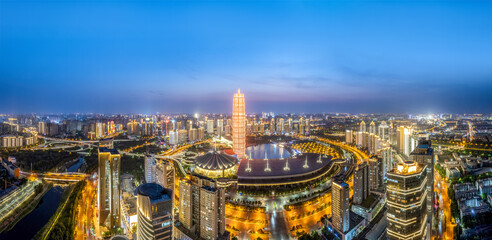 Vibrant City Nightscape with Illuminated Skyscrapers