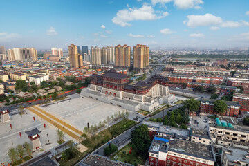 Fototapeta premium Historic Temple with Urban Skyline Aerial View