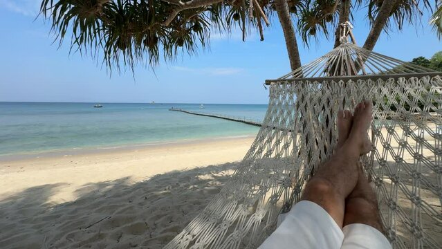 Relaxing in a hammock on the beach in Bang Tao, Phuket, Thailand