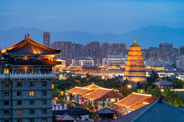 Illuminated Cityscape with Ancient Pagoda