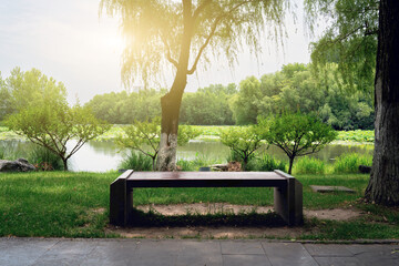 Peaceful Lakeside Park Bench at Sunset