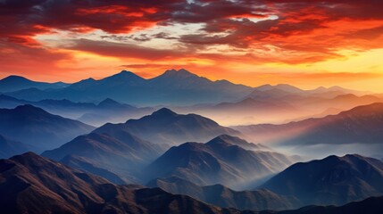 Obraz premium a majestic mountain range bathed in the warm hues of a fiery sunrise 