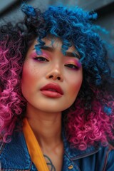 Fototapeta premium street portrait of an edgy stylish asian woman with wild curly hair