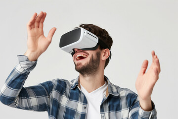 Naklejka premium A young man wearing a virtual reality headset (VR) and enjoying a virtual reality experience.