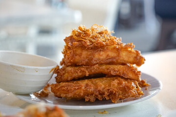 Close up of crispy deep fried banana, with burry background