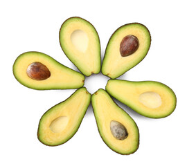 Halves of tasty ripe avocados on white background