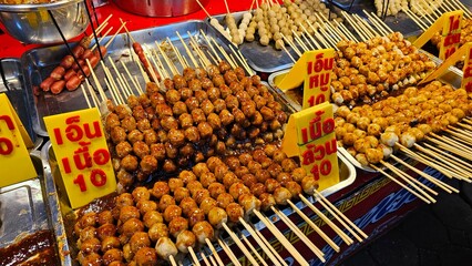 Famous street food in Thailand, grilled meatballs, fried meatballs, grilled s Thailand highlights, Thailand tour