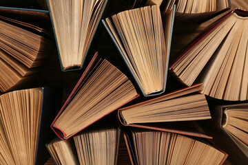 Pile of old hardcover books as background