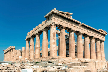 Wide angle panorama of Greek Parthenon at the Acropolis on a clear sky, sunny summer day.