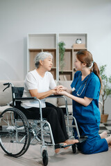 Fototapeta premium Asian caregiver doctor examine older patient woman therapist nurse at nursing home taking care of senior elderly woman sit on sofa.Medical service concept.
