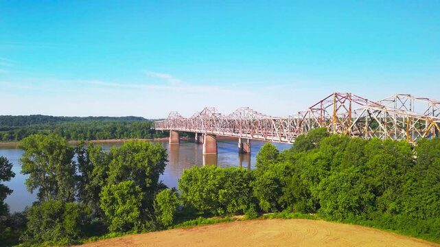 Drone footage of the Audubon Memorial Bridge spanning the Ohio River on a sunny day in United States