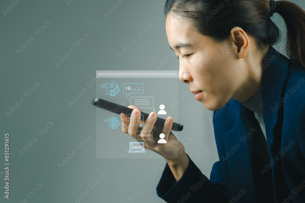 Poster business woman chatting with chatbot via mobile smart phone application while working on laptop comp