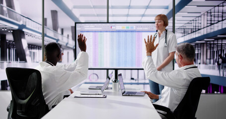 Doctors Asking Questions And Voting At Medical Presentation