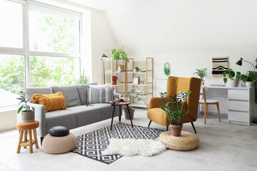 Interior of living room with sofa, armchair and witch's magic attributes on table