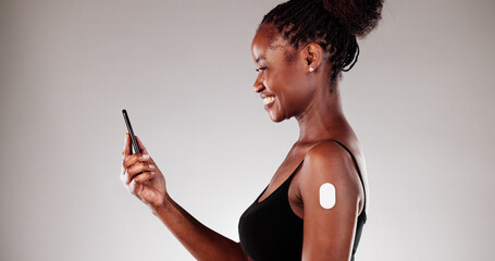 Medical Technician Monitoring Patient's Glucose Levels Using Smart Phone App