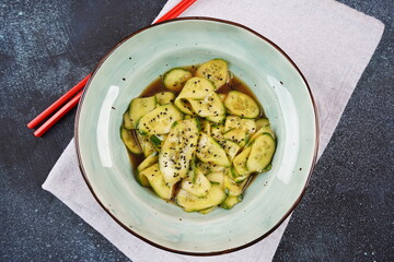 Sunomono, Japanese Cucumber Salad, sliced cucumbers with  dressing of soy sauce, rice vinegar, sesame oil and sugar