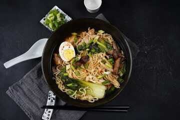 Japanese Ramen with chicken, Mushrooms, Eggs and bok choy cabbage in a bowl