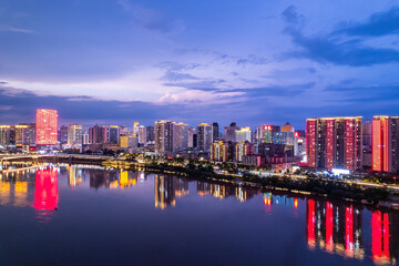 Obraz premium Aerial photography of the night scene on the east bank of the Xiangjiang River in Zhuzhou, China